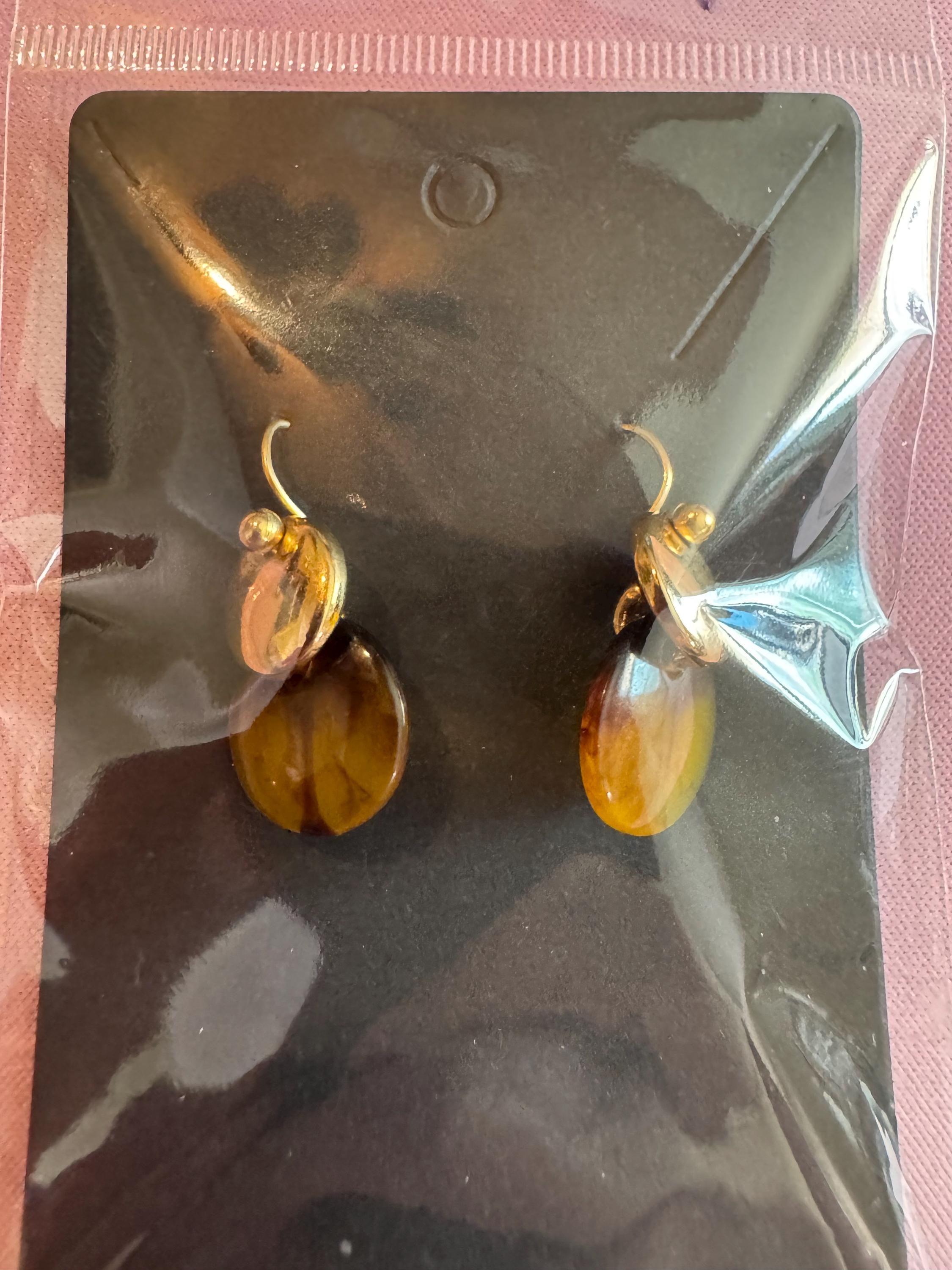 Amber Dip Dangle Earrings With Gold Tone Accents.