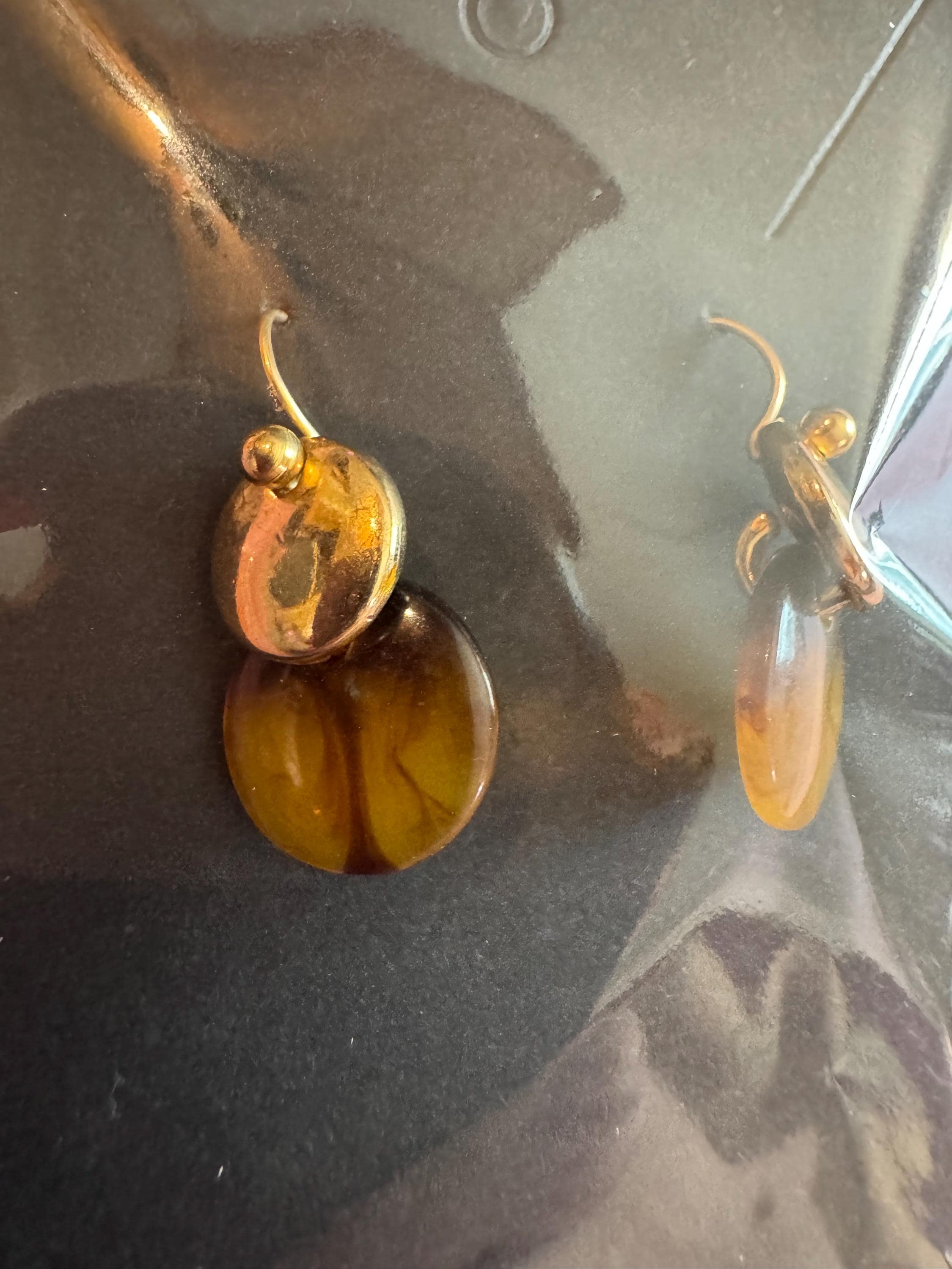Amber Dip Dangle Earrings With Gold Tone Accents.