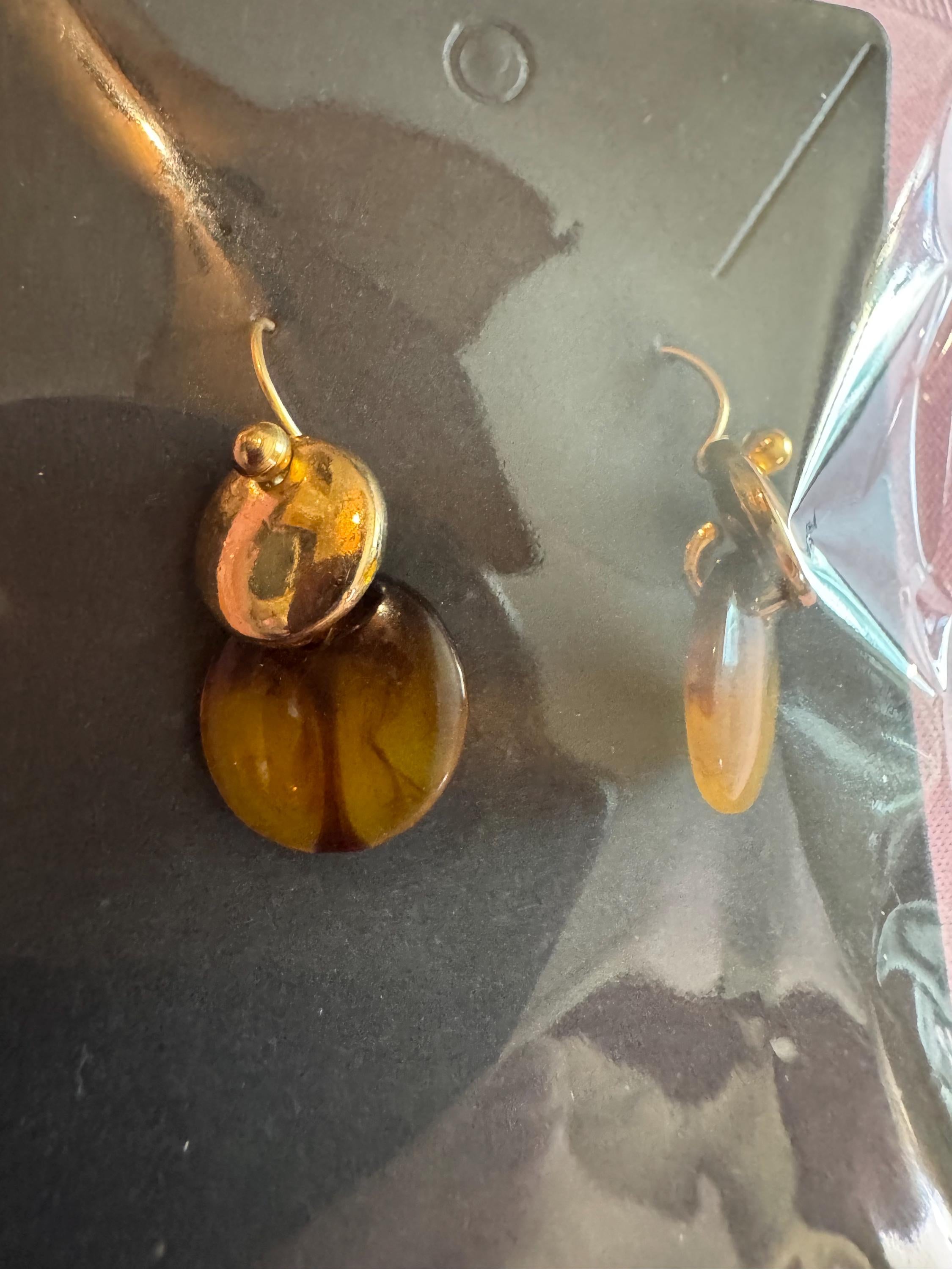 Amber Dip Dangle Earrings With Gold Tone Accents.