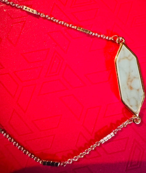 Adjustable Silver Toned Bracelet w/ Blue Colored Stone.